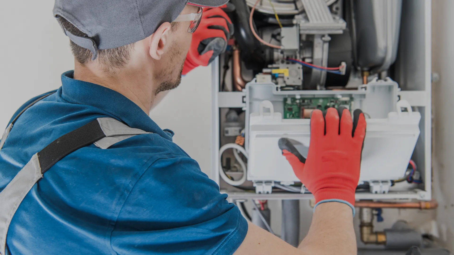 Technician performing HVAC maintenance